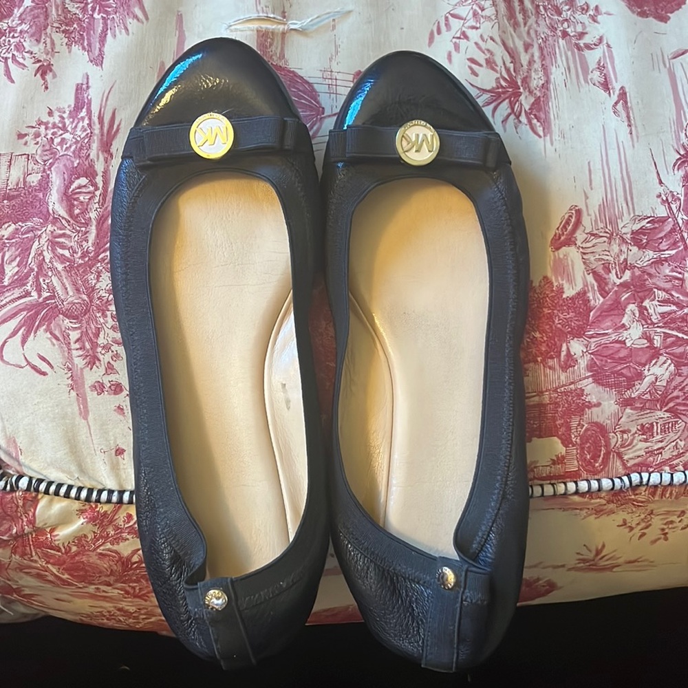 Previously worn Michael Kors black leather flats.  Size 9.5